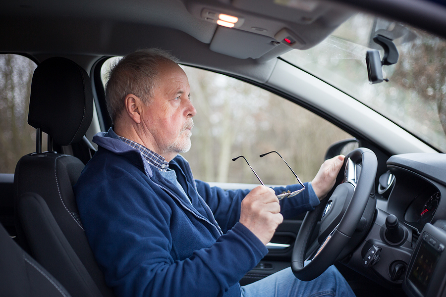 Elderly man taking driving evaluation for seniors